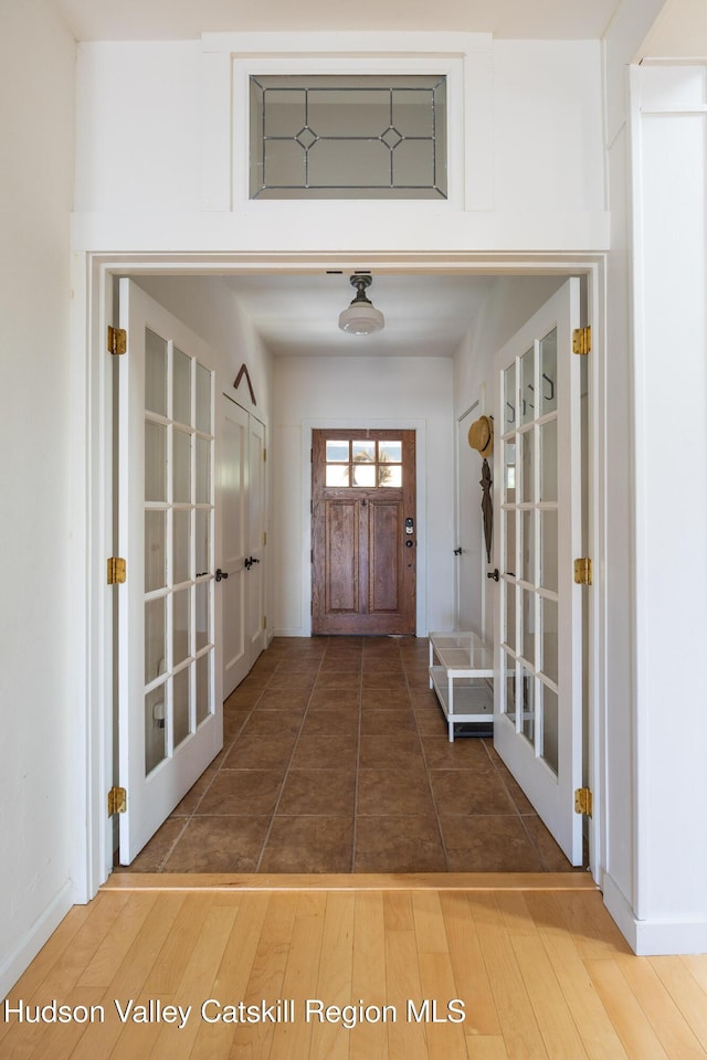 interior space with french doors and wood finished floors
