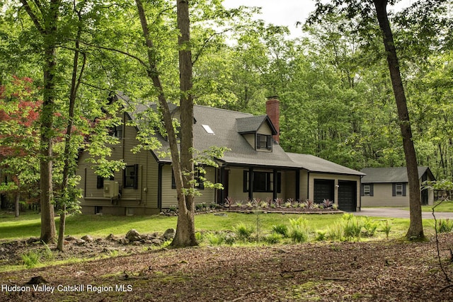 55 Ginger Rd, High Falls, NY 12440 - view of front facade featuring an attached garage, a chimney, a front yard, and asphalt driveway