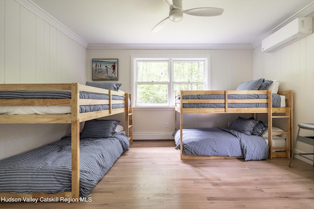 55 Ginger Rd, High Falls, NY 12440 - bedroom with a wall mounted air conditioner, crown molding, wood finished floors, baseboard heating, and wood walls