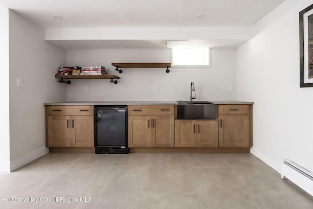 55 Ginger Rd, High Falls, NY 12440 - bar area with a baseboard radiator, a sink, baseboards, beverage cooler, and concrete floors