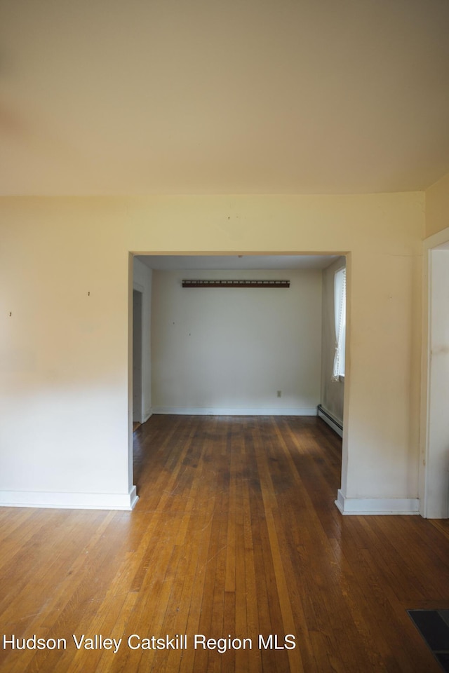50 Payn Ave, Chatham, NY 12037 - spare room featuring baseboard heating and wood finished floors