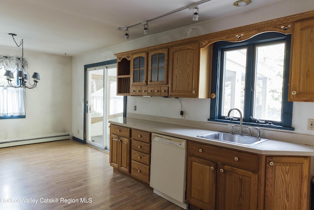 50 Payn Ave, Chatham, NY 12037 - kitchen with white dishwasher, brown cabinets, a chandelier, and healthy amount of natural light