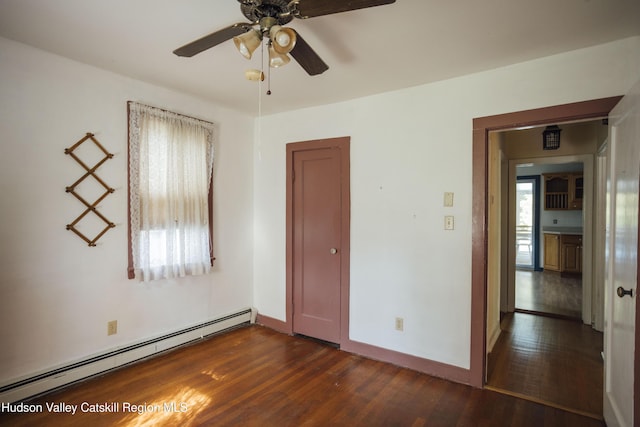 50 Payn Ave, Chatham, NY 12037 - unfurnished room with a baseboard radiator, dark wood-style flooring, and ceiling fan