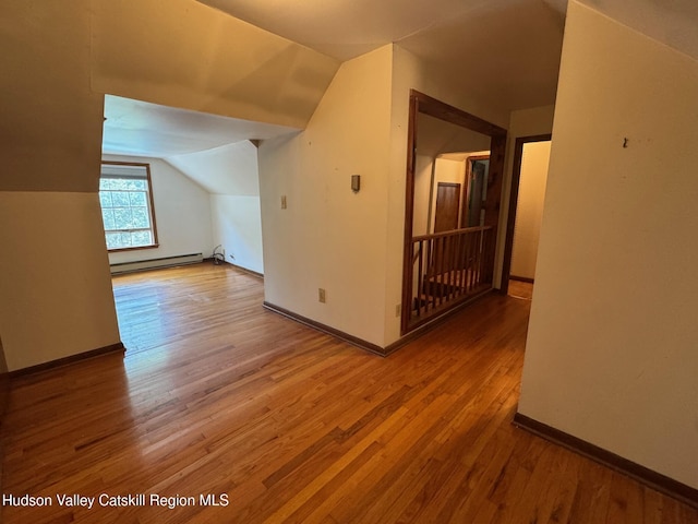 50 Payn Ave, Chatham, NY 12037 - additional living space featuring a baseboard radiator, lofted ceiling, and wood finished floors