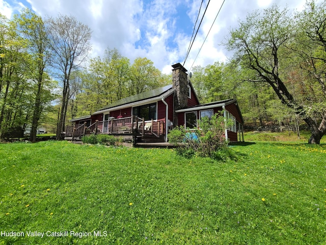 223 Church Rd, Livingston Manor, NY 12758 - back of house featuring a chimney, a yard, and a deck