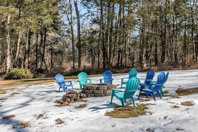 view of patio / terrace featuring an outdoor fire pit