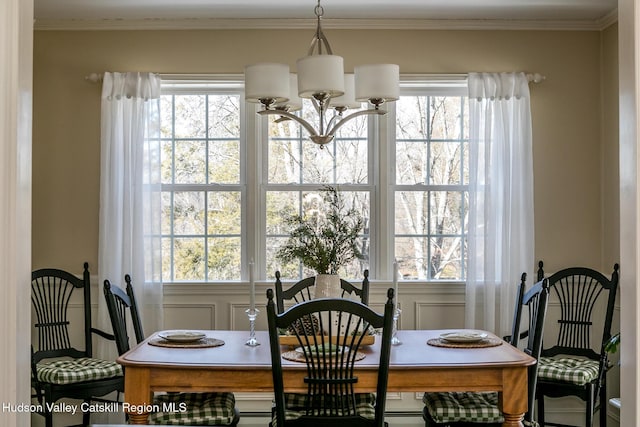 dining room featuring a chandelier and crown molding