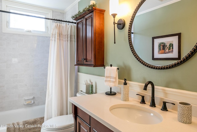 bathroom featuring vanity, shower / tub combo, toilet, and ornamental molding