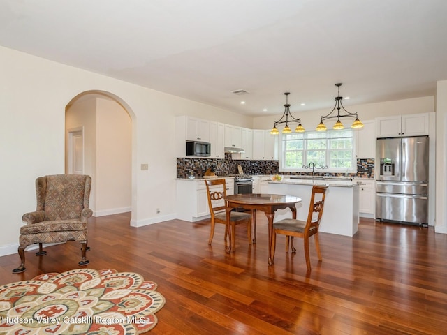40 Bridle Path Ln, High Falls, NY 12440 - dining area featuring arched walkways, dark wood finished floors, and recessed lighting