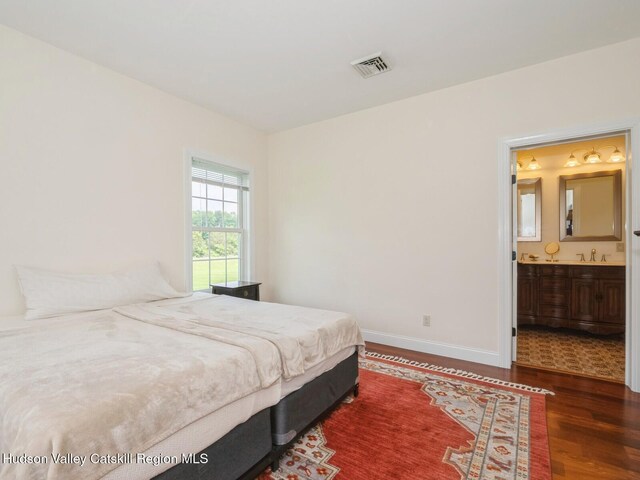 40 Bridle Path Ln, High Falls, NY 12440 - bedroom featuring wood finished floors and ensuite bathroom