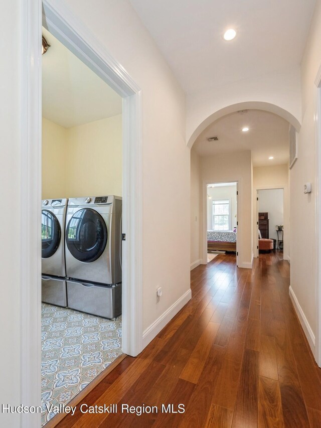 40 Bridle Path Ln, High Falls, NY 12440 - washroom with arched walkways, washer and clothes dryer, hardwood / wood-style flooring, and recessed lighting