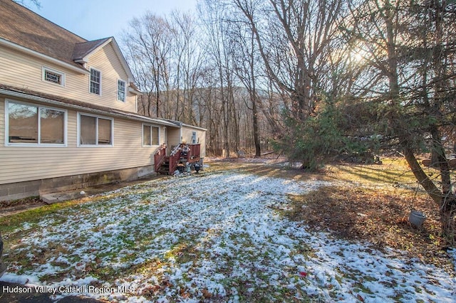 view of yard covered in snow