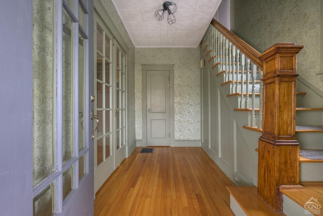 2 W Marie St, Hudson, NY 12534 - entryway with wallpapered walls, hardwood / wood-style flooring, and stairs