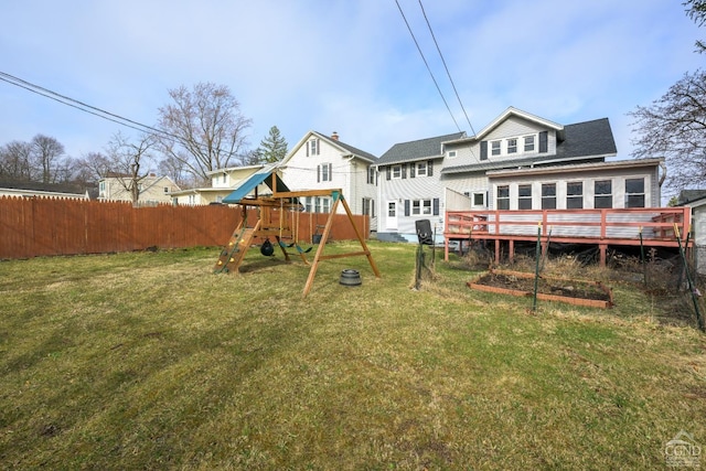 2 W Marie St, Hudson, NY 12534 - rear view of house with a playground and a wooden deck