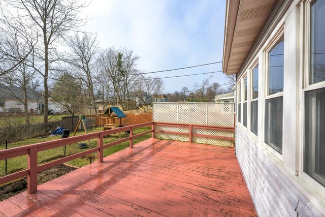 2 W Marie St, Hudson, NY 12534 - wooden deck featuring a playground and a fenced backyard