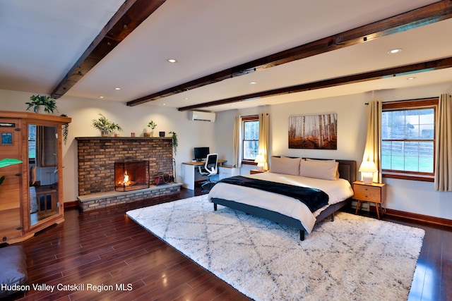 bedroom with beamed ceiling, dark hardwood / wood-style floors, and multiple windows