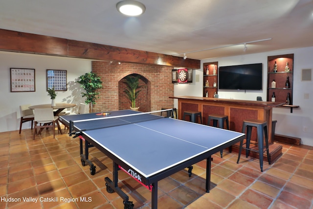 playroom featuring beam ceiling and tile patterned floors