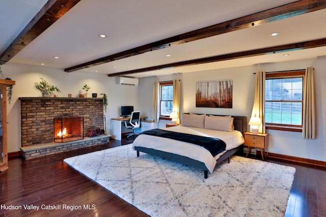 bedroom with a wall mounted air conditioner, beam ceiling, dark hardwood / wood-style floors, and a fireplace