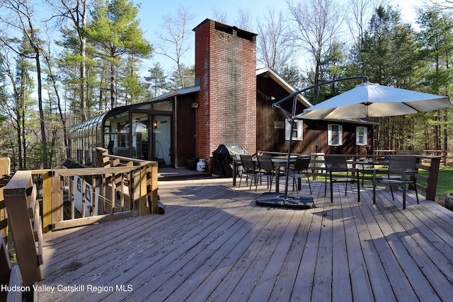 wooden terrace with area for grilling