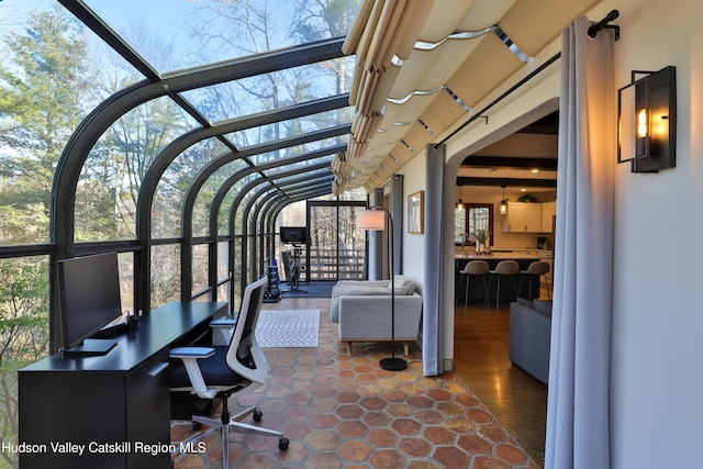 sunroom / solarium with a wealth of natural light