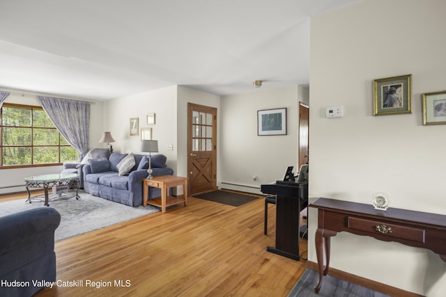 27 Upper Cady Rd, Old Chatham, NY 12136 - living area with light wood-style floors and a baseboard radiator