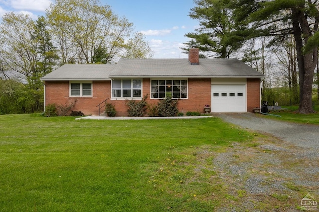 27 Upper Cady Rd, Old Chatham, NY 12136 - single story home with an attached garage, brick siding, gravel driveway, a chimney, and a front lawn