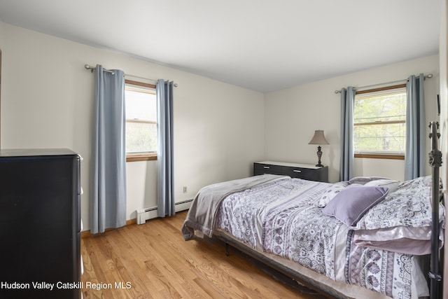 27 Upper Cady Rd, Old Chatham, NY 12136 - bedroom featuring light wood-type flooring and a baseboard radiator