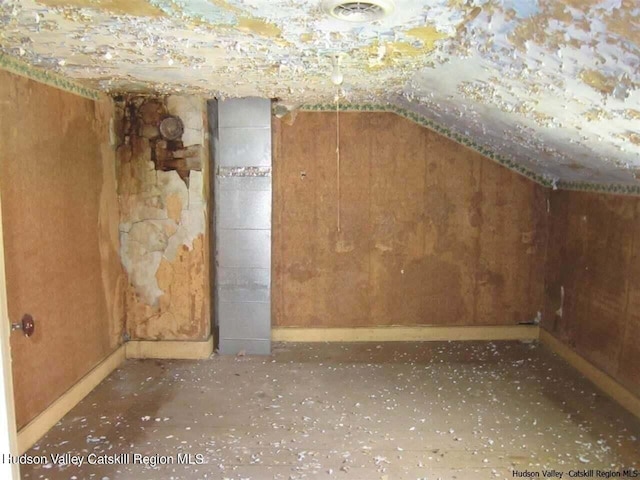 bonus room featuring lofted ceiling