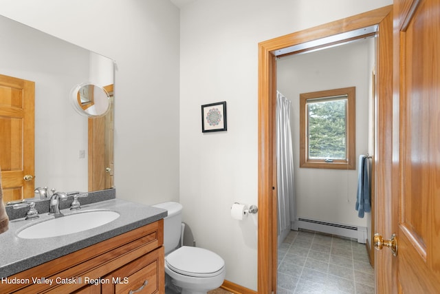 bathroom with vanity, a baseboard radiator, and toilet