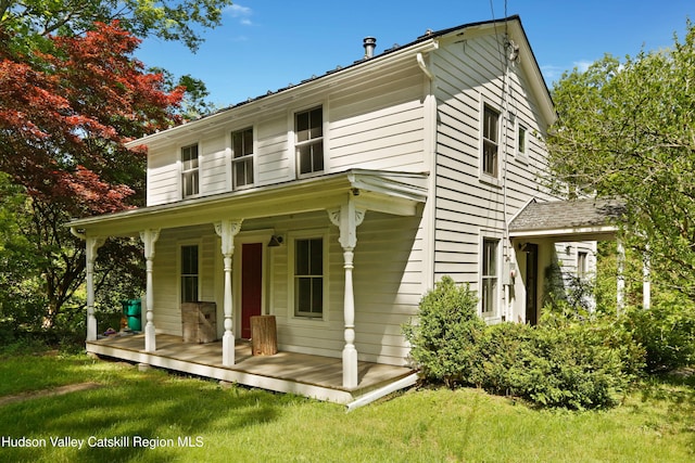 1130 Sawkill Rd, Kingston, NY 12401 - view of front facade with covered porch and a front yard