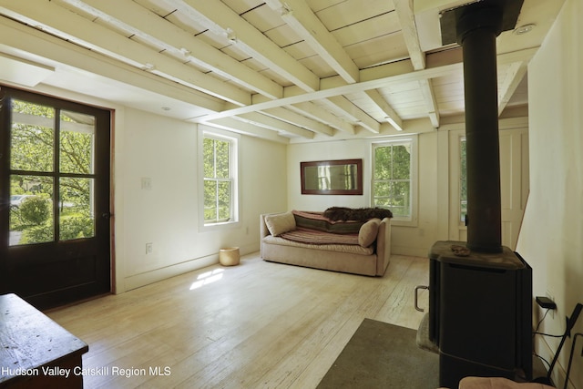 1130 Sawkill Rd, Kingston, NY 12401 - living area with a wood stove, light wood-type flooring, and beamed ceiling