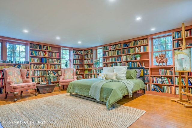 bedroom featuring recessed lighting and wood finished floors