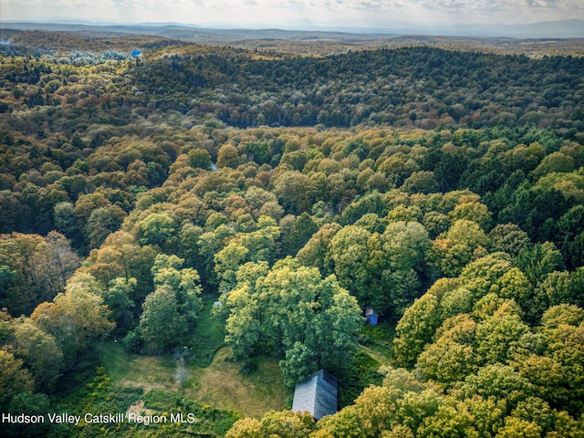 birds eye view of property featuring a view of trees