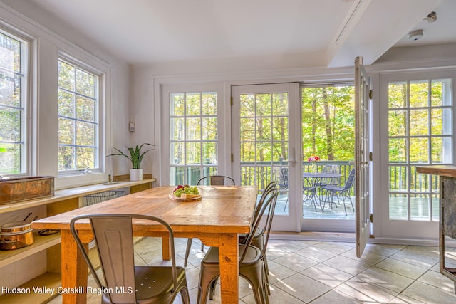 dining area with light tile patterned floors