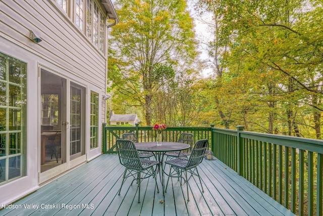 deck with outdoor dining space