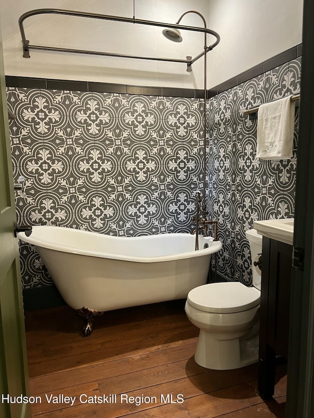 36 Rodney St, Kingston, NY 12401 - bathroom featuring a freestanding tub, wood-type flooring, and vanity