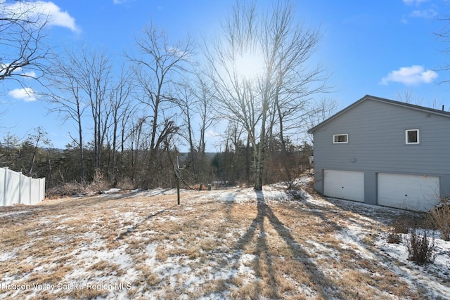 1920 Old Kings Hwy, Saugerties, NY 12477 - yard layered in snow featuring a garage
