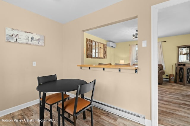 1920 Old Kings Hwy, Saugerties, NY 12477 - dining room featuring baseboard heating, an AC wall unit, a baseboard heating unit, and wood finished floors
