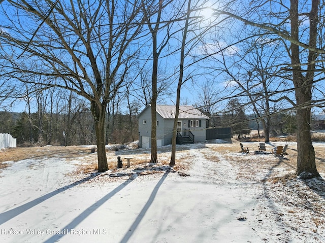 view of yard covered in snow