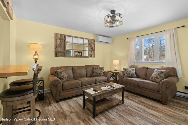 1920 Old Kings Hwy, Saugerties, NY 12477 - living area with a baseboard radiator, baseboards, wood finished floors, and a wall unit AC