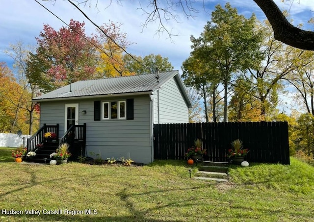 1920 Old Kings Hwy, Saugerties, NY 12477 - rear view of house featuring fence, a lawn, and metal roof