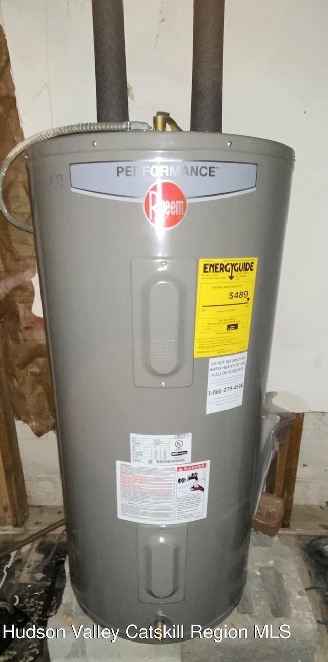 utility room featuring water heater