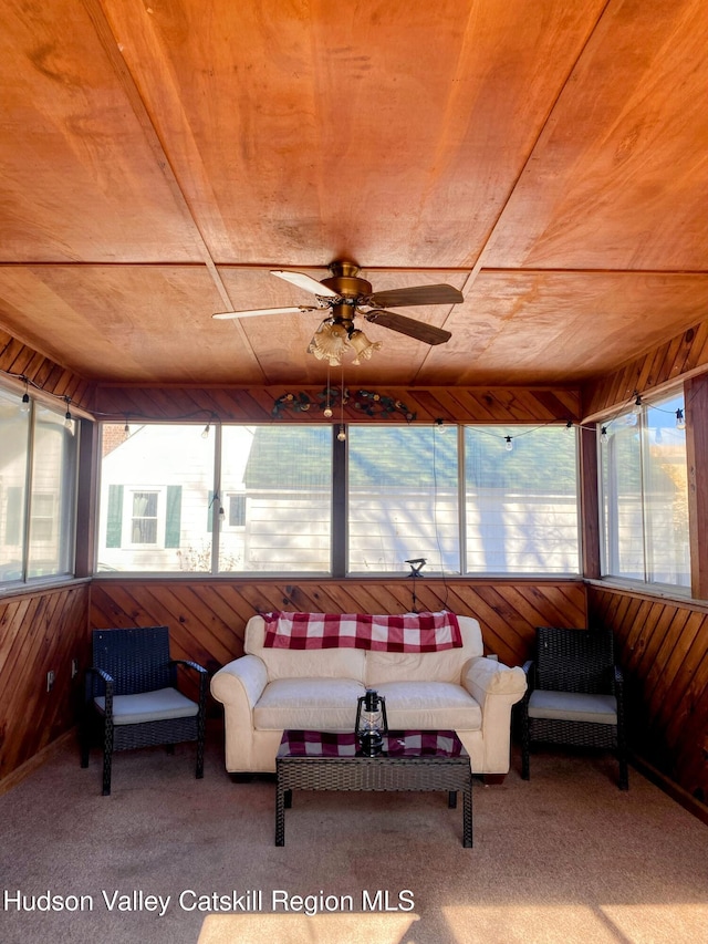 sunroom / solarium featuring ceiling fan