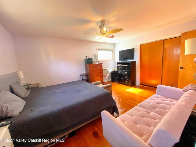 bedroom with a ceiling fan and light wood-type flooring