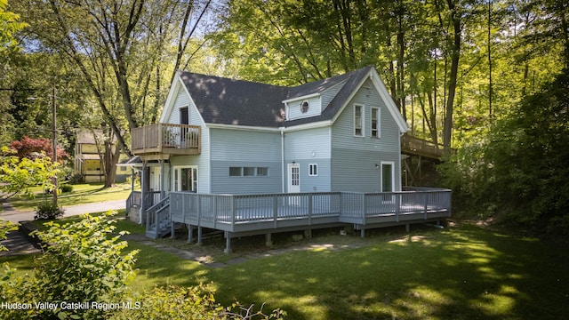 186 2nd St, Port Ewen, NY 12417 - rear view of property featuring a balcony, a yard, roof with shingles, and a deck