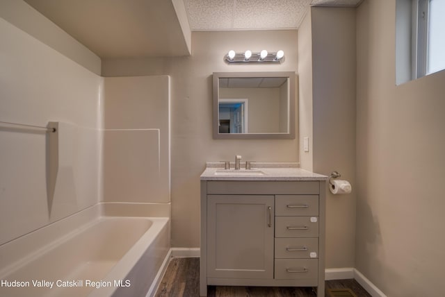 186 2nd St, Port Ewen, NY 12417 - bathroom with vanity, baseboards, bathing tub / shower combination, and wood finished floors