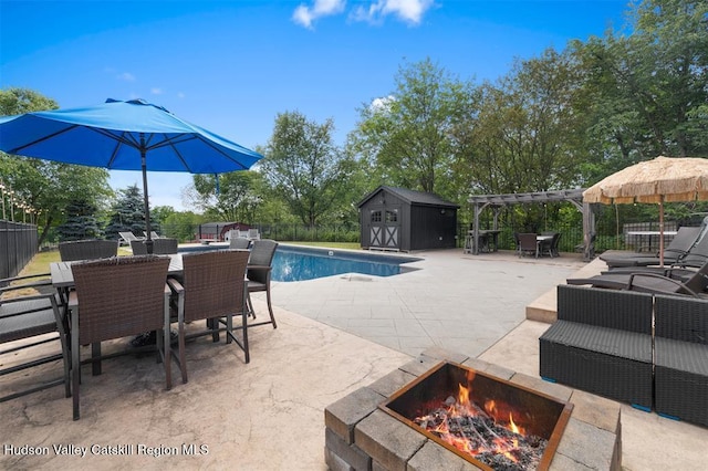 10 Sutton Ln, Goshen, NY 10924 - view of swimming pool featuring a patio, a shed, outdoor dining space, an outdoor fire pit, and a pergola