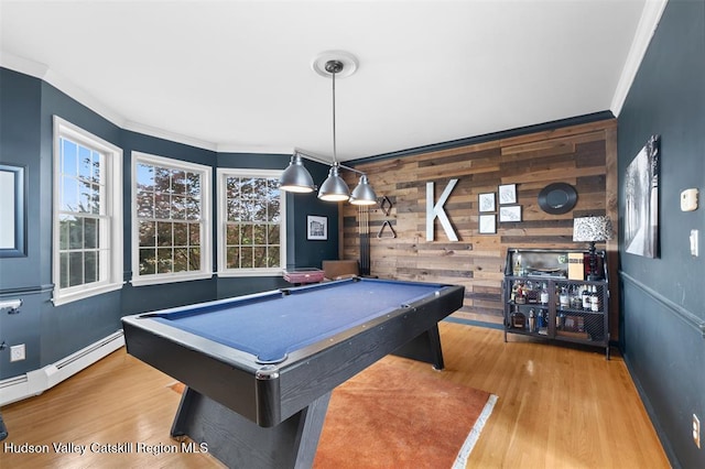 10 Sutton Ln, Goshen, NY 10924 - playroom featuring pool table, wooden walls, ornamental molding, wood finished floors, and a baseboard heating unit