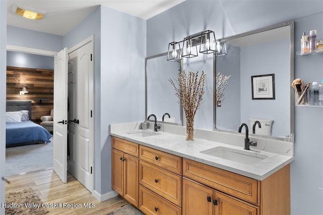 10 Sutton Ln, Goshen, NY 10924 - full bath featuring wood finished floors, double vanity, and ensuite bathroom