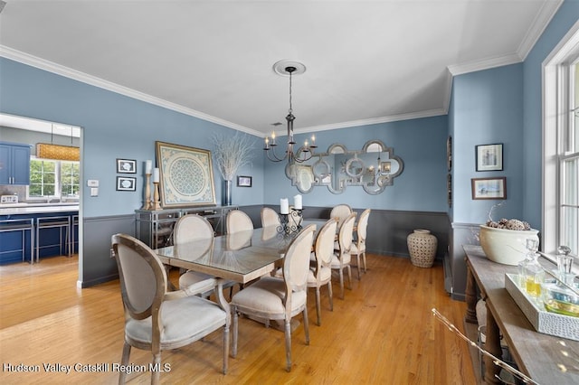 10 Sutton Ln, Goshen, NY 10924 - dining space with a chandelier, ornamental molding, and light wood finished floors